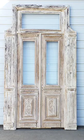 Pair of Washed Antique Wood Single Lite French Carved Doors with Transom Window
