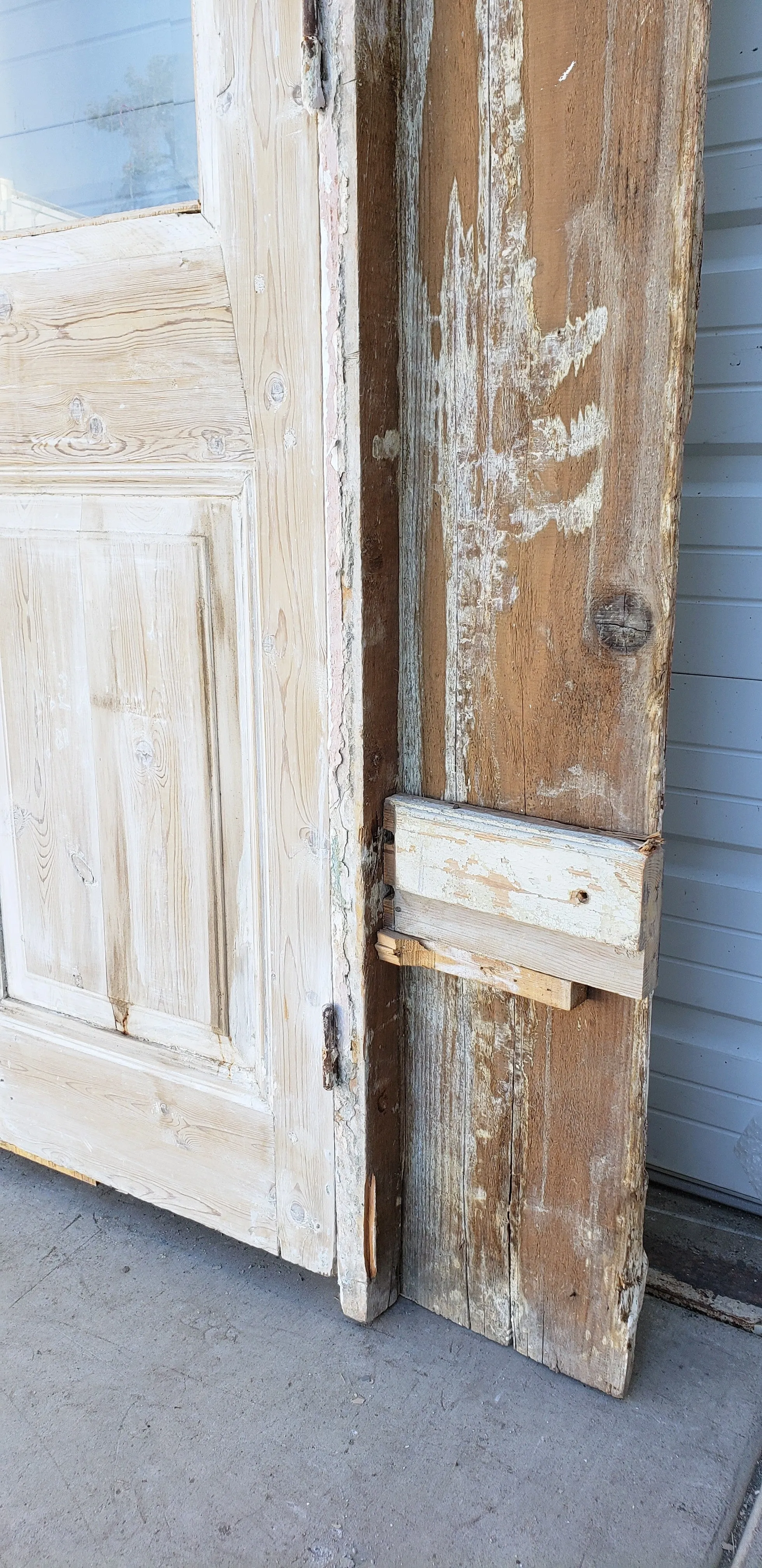 Pair of Washed Antique Wood Single Lite French Carved Doors with Transom Window